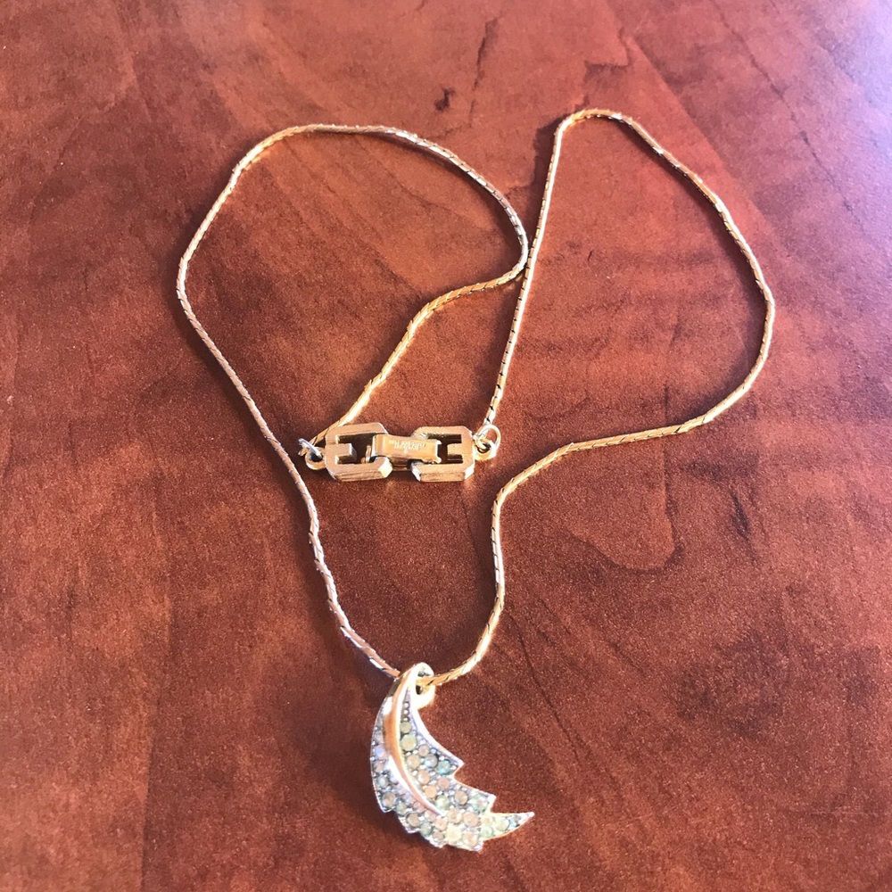 Givenchy gold tone necklace with green stone.